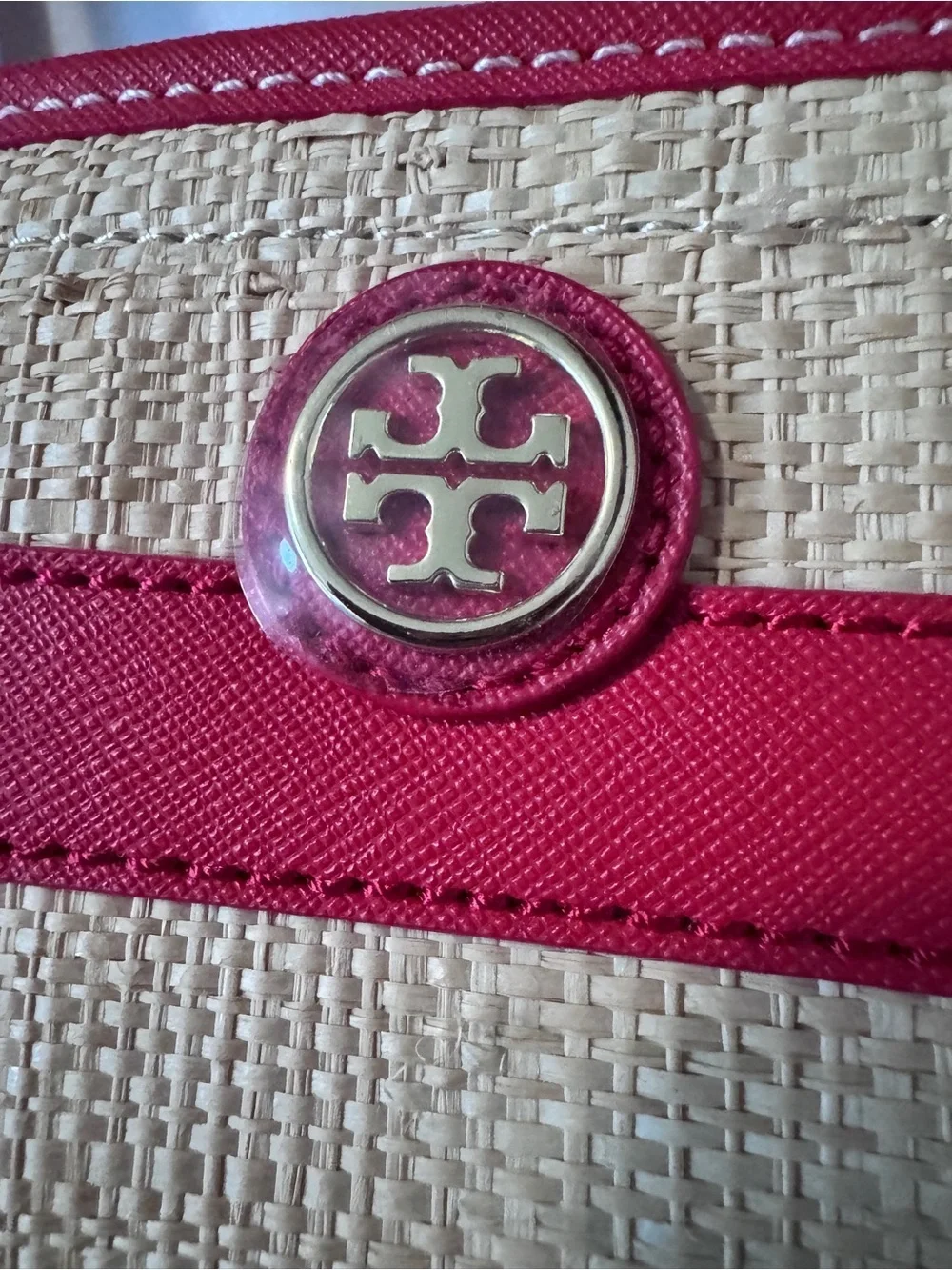 Tory Burch straw tote features vibrant red leather stripes